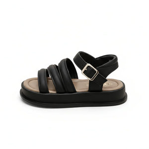 Black cushioned sandal with padded straps and adjustable buckle on white background