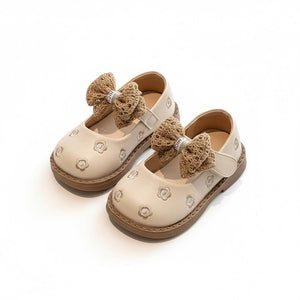 Elegant beige baby girl shoes with embroidered flowers and large woven bow accents