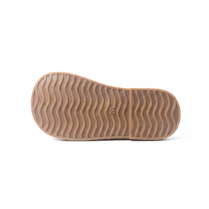 Gum rubber sole of kids loafers with wavy tread pattern, size 29, isolated on white