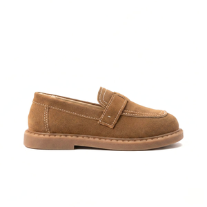 Caramel suede kids loafers with buckle detail and stitched accents on brown rubber sole
