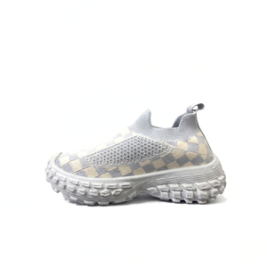 Gray and cream checkered knit kids slip-on shoe with chunky textured sole