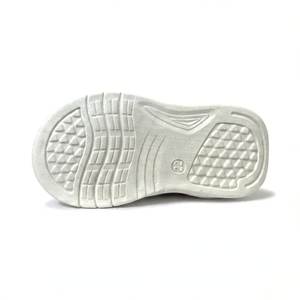 White shoe sole with textured pattern on a white background