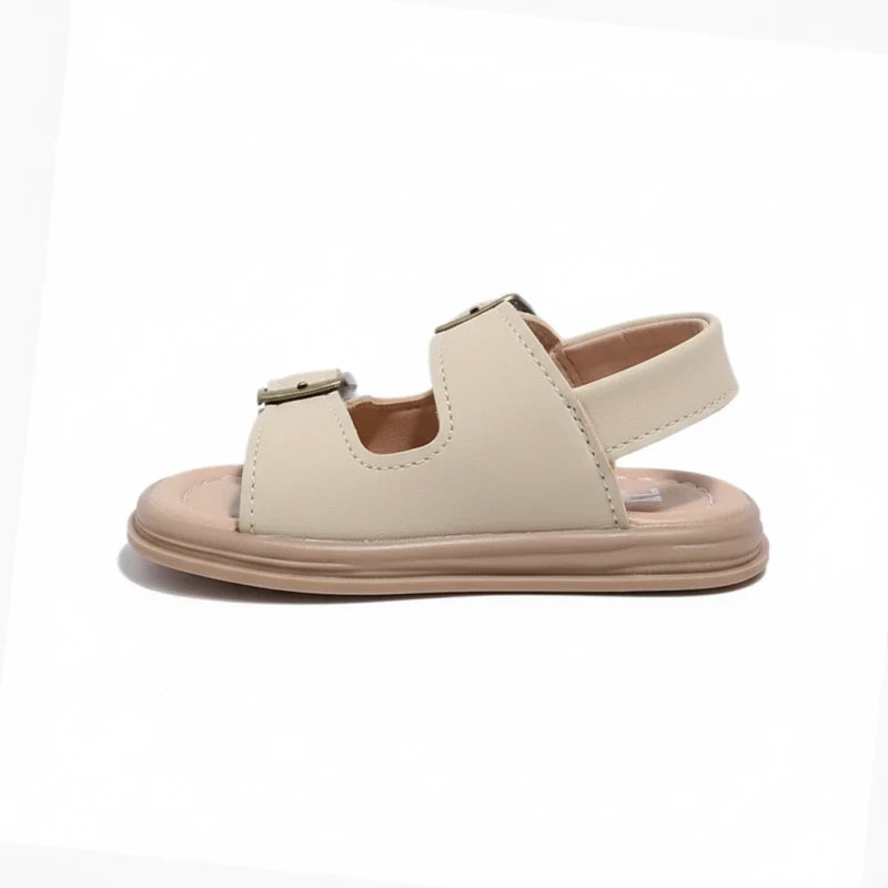 Beige toddler sandal with adjustable buckle straps and cushioned sole on white background