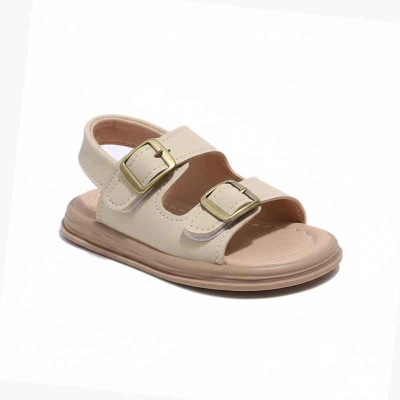 Beige toddler sandal with double brass buckles and cushioned sole on white background