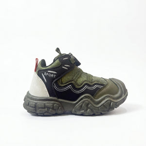 Green and black kids sport sneaker with rugged sole and red heel loop