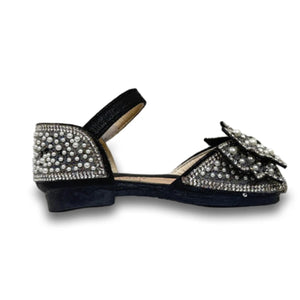 Black baby shoe with pearl and rhinestone embellishments and a bow detail