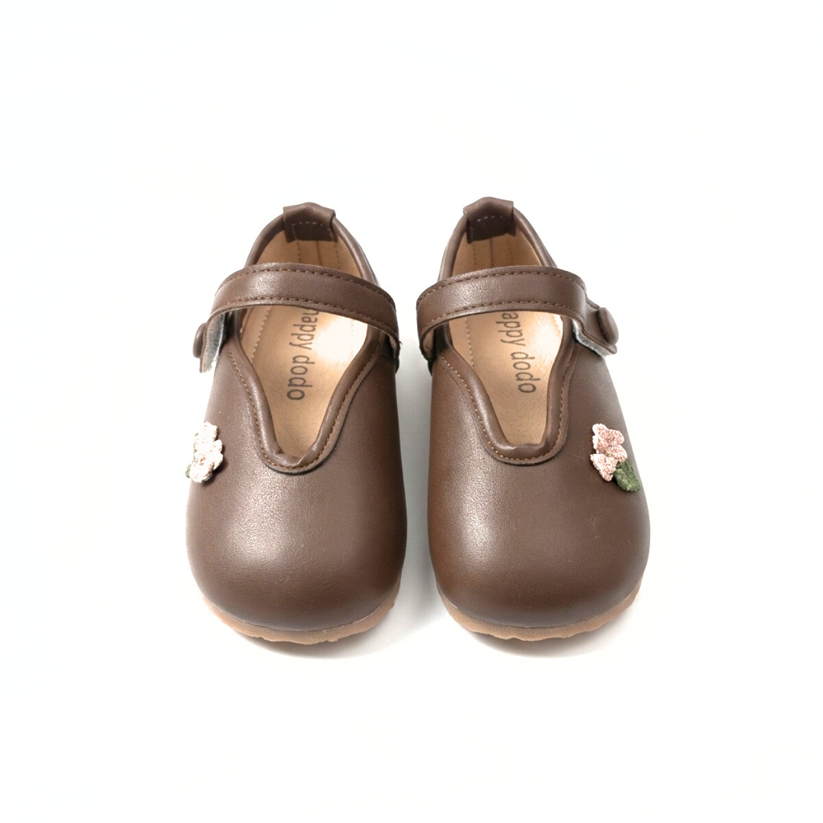 Brown Mary Jane shoes for kids with floral strap detail on white background