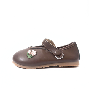 Brown leather Mary Jane shoe with a pink floral embroidery and a button strap
