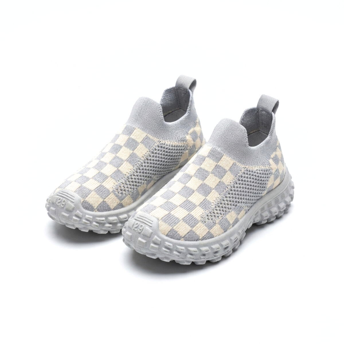 Light gray and cream checkered knit kids slip-on sneakers with textured soles