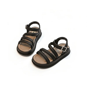 Black triple-strap sandals with buckle closure and cushioned beige footbed on white background