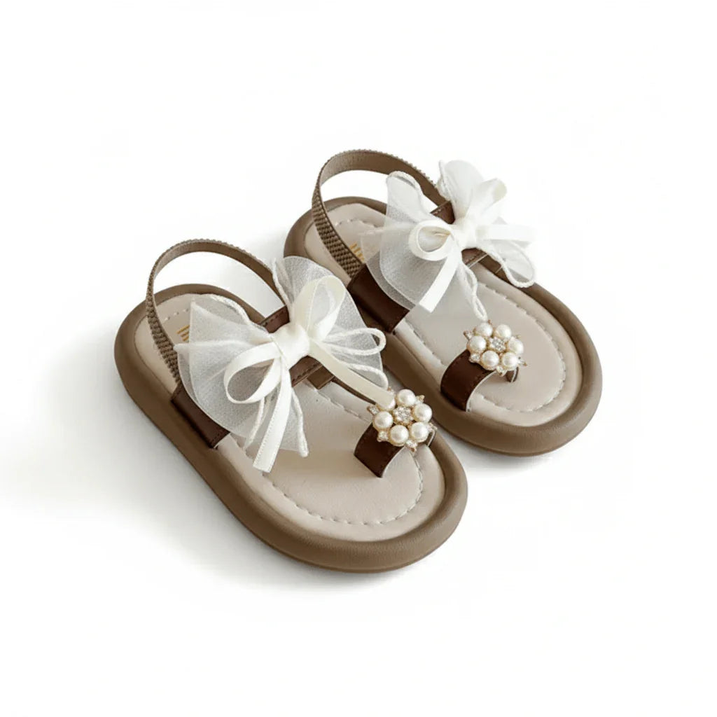Brown baby girl sandals with white tulle bows and pearl flower accents on toe straps
