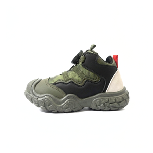 Green and black children's boot on a white background