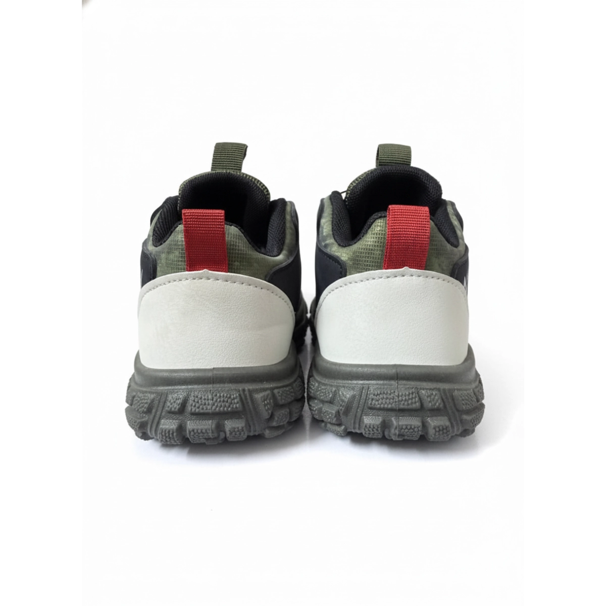 Rear view of rugged kids sneakers with grey soles, white heel panels, and red pull tabs on white background