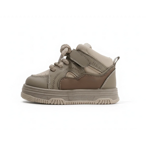 Side view of brown high-top kids sneaker with laces and velcro strap on white background