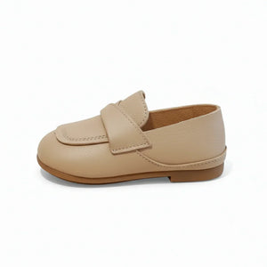 Classic brown baby loafer shoe in leather with a strap detail on a white background