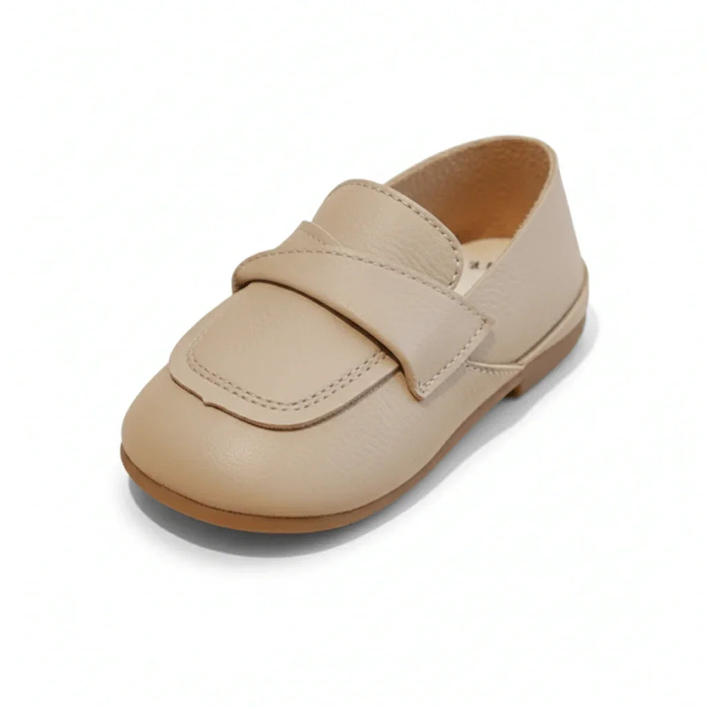 Classic brown leather baby loafer shoe with stitched strap and rubber sole